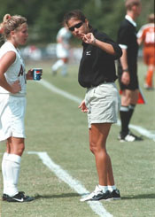 Photo of coach and player on field